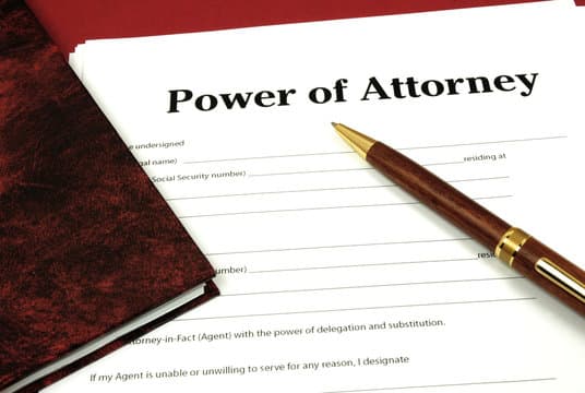 A close-up photo of a paper showing 'Power of Attorney for Estate Planning' with 'Power Of Attorney Documents' in the backdrop.
